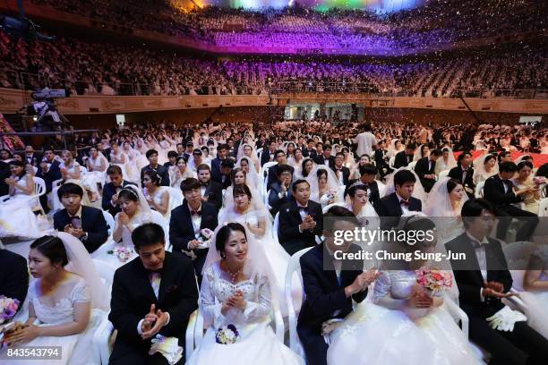 Thousands of couples attend a mass wedding held by the Family Federation for World Peace and Unification, aka Unification Church on September 7, 2017...