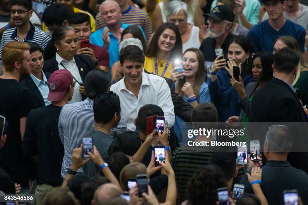 Justin Trudeau, Canada's Prime Minister, walks through a crowd while arriving at a town hall meeting at the University of British Columbia Okanagan...