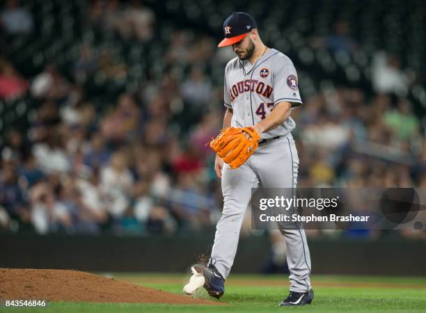 Starting pitcher Lance McCullers Jr. Of the Houston Astros kicks the rosin bag after giving up a run during the sixth inning of a game against the...