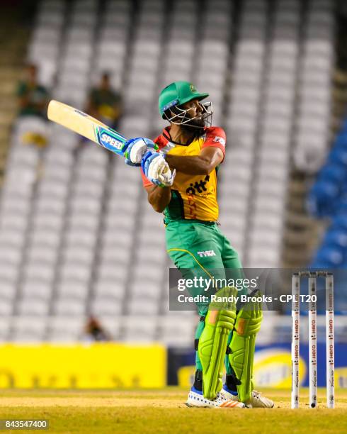 In this handout image provided by CPL T20, Assad Fudadin of Guyana Amazon Warriors hits 6 during Eliminator 1 of the 2017 Hero Caribbean Premier...