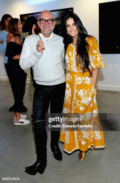 Celebrity floral and fragrance designer Eric Buterbaugh and Demi Moore attend the private opening of Sascha von Bismarck debut photography...