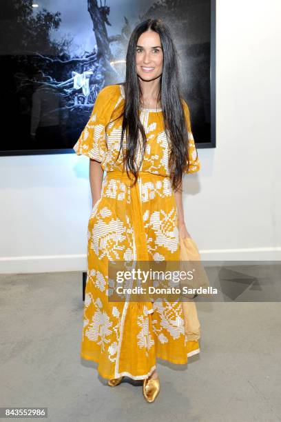 Demi Moore and celebrity floral and fragrance designer Eric Buterbaugh attend the private opening of Sascha von Bismarck debut photography...