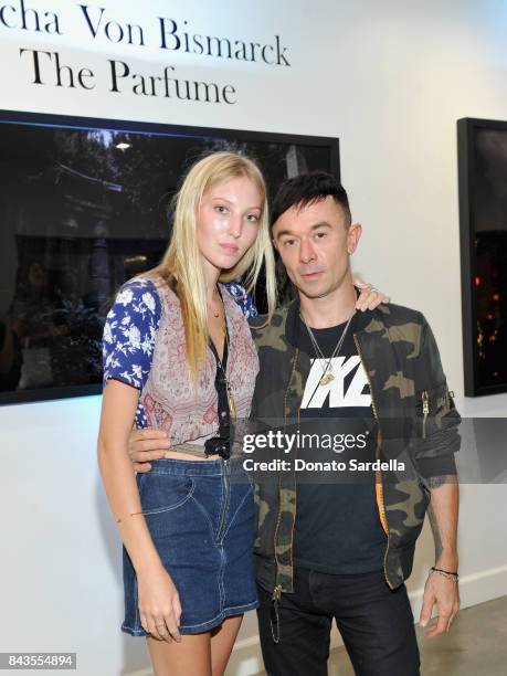 Ella Richards, Robbie Furze and celebrity floral and fragrance designer Eric Buterbaugh attend the private opening of Sascha von Bismarck debut...