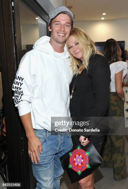 Patrick Schwarzenegger, Sheryl Berkoff Lowe and celebrity floral and fragrance designer Eric Buterbaugh attend the private opening of Sascha von...