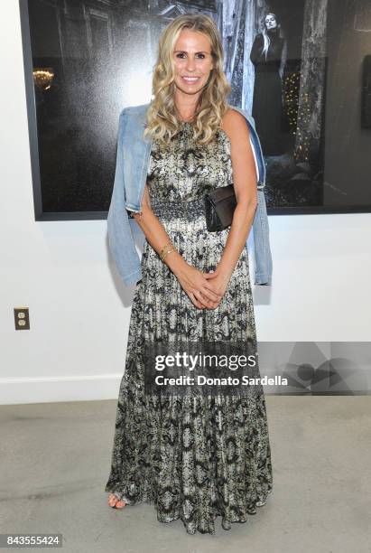 Natasha Croxall and celebrity floral and fragrance designer Eric Buterbaugh attend the private opening of Sascha von Bismarck debut photography...