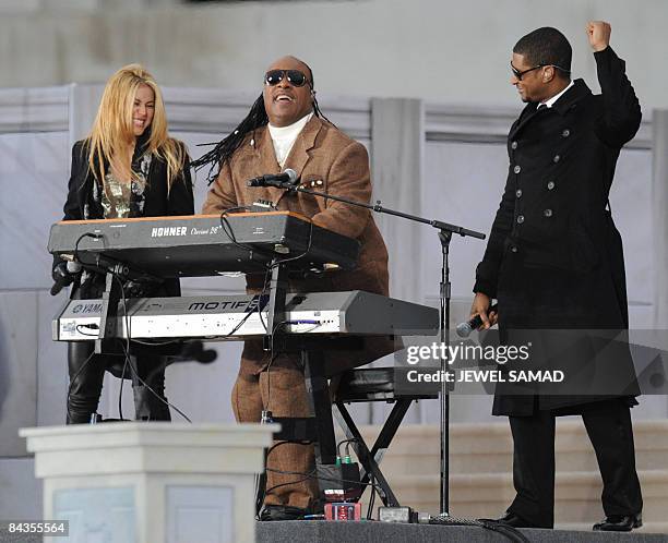 Musicians Stevie Wonder , Usher and Colombian singer Shakira perform during the 'We Are One" concert, one of the events of US president-elect Barack...