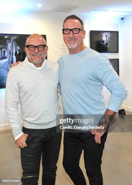 Celebrity floral and fragrance designer Eric Buterbaugh and Chuck Billen attend the private opening of Sascha von Bismarck debut photography...