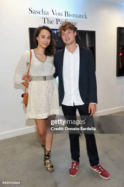 Josephine von Oswald, Photographer Sascha von Bismarck and celebrity floral and fragrance designer Eric Buterbaugh attend the private opening of...