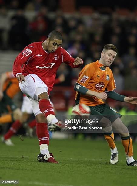 Lewis McGugan of Nottingham Forest plays the ball past Paul Gallagher of Plymouth Argyle during the Coca Cola Championship match between Nottingham...