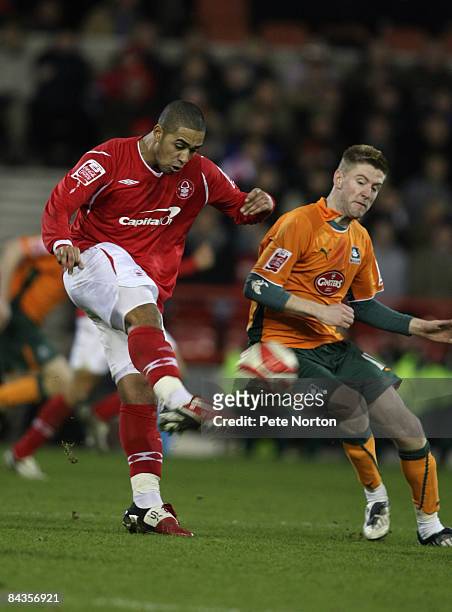 Lewis McGugan of Nottingham Forest plays the ball past Paul Gallagher of Plymouth Argyle during the Coca Cola Championship match between Nottingham...