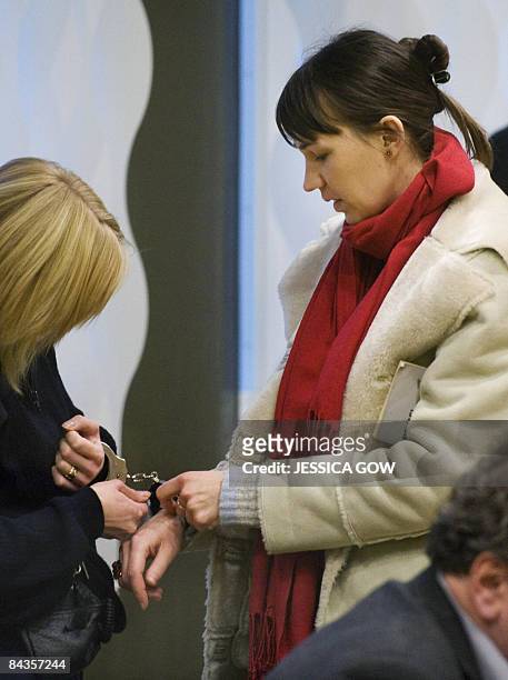 Christine Schuerrer is handcuffed at the end of the hearing in the Svea Court of Appeal in Vasteras, Sweden, on January 19, 2009. Schuerrer, a German...