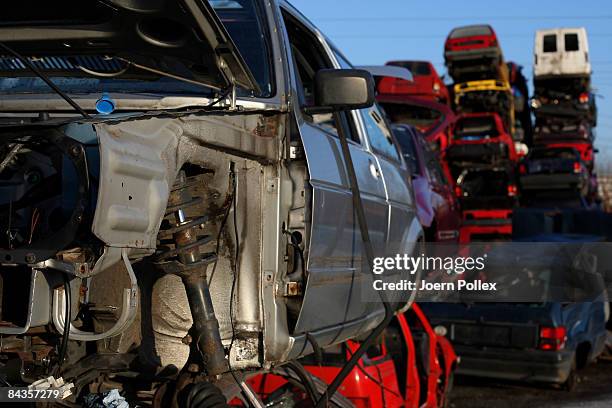 Wreckages of cars are piled up at a scrap yard on January 19, 2009 in Hamburg, Germany. Germany unveiled a new 50 billion euro stimulus package on...