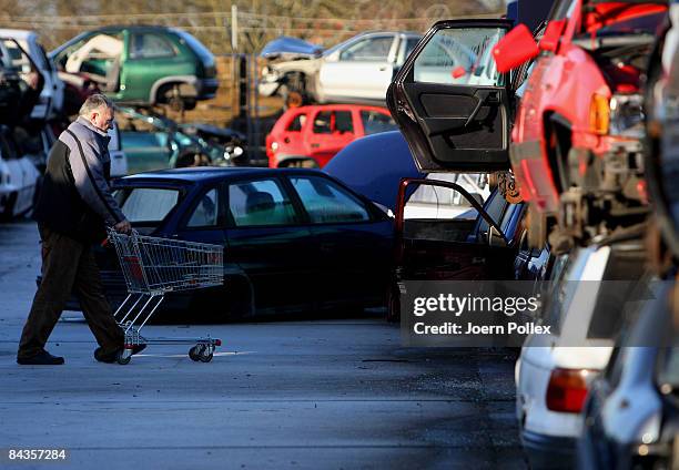 Wreckages of cars are piled up at a scrap yard on January 19, 2009 in Hamburg, Germany. Germany unveiled a new 50 billion euro stimulus package on...