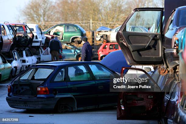 Wreckages of cars are piled up at a scrap yard on January 19, 2009 in Hamburg, Germany. Germany unveiled a new 50 billion euro stimulus package on...