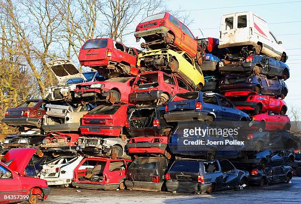 Wreckages of cars are piled up at a scrap yard on January 19, 2009 in Hamburg, Germany. Germany unveiled a new 50 billion euro stimulus package on...