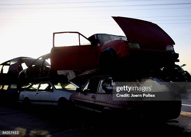 Wreckages of cars are piled up at a scrap yard on January 19, 2009 in Hamburg, Germany. Germany unveiled a new 50 billion euro stimulus package on...