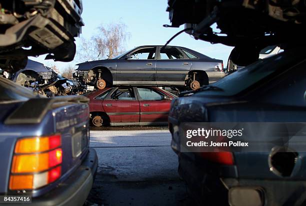 Wreckages of cars are piled up at a scrap yard on January 19, 2009 in Hamburg, Germany. Germany unveiled a new 50 billion euro stimulus package on...