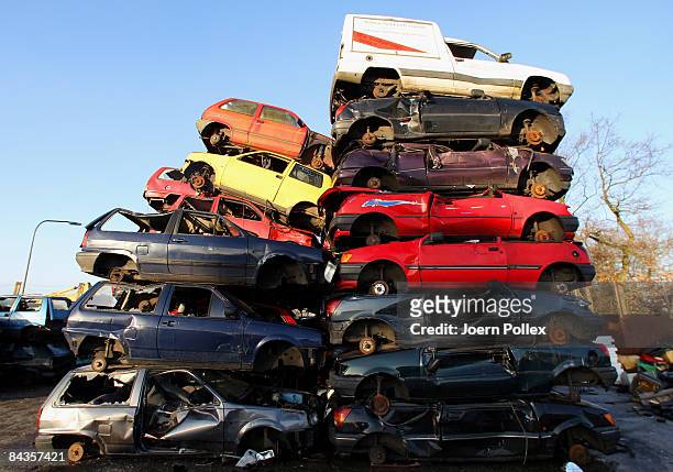 Wreckages of cars are piled up at a scrap yard on January 19, 2009 in Hamburg, Germany. Germany unveiled a new 50 billion euro stimulus package on...