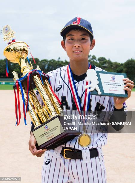 Infielder Yoshii Harue of Japan, the best shortstop of the All-Star Team awards, poses for photo with medal and trophy during the BFA Women's...
