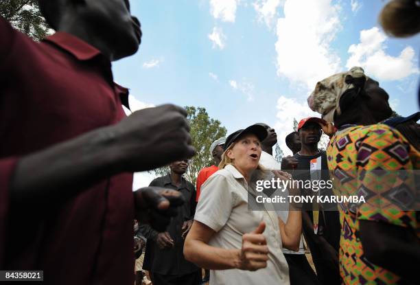 Julie Boyd from Seatle,WA, dances along villagers of Nyang'oma in Kogelo as they sing and dance to welcome tourists on January 19, 2009 during...