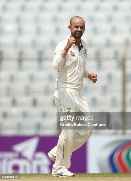 Nathan Lyon of Australia celebrates after taking the wicket of Sabbir Rahman Roman of Bangladesh during day four of the Second Test match between...