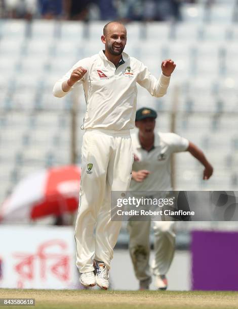 Nathan Lyon of Australia celebrates after taking the wicket of Sabbir Rahman Roman of Bangladesh during day four of the Second Test match between...