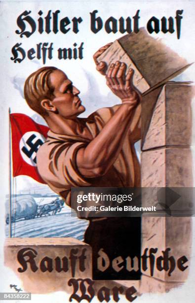 Nazi Party poster depicts a man constructing a wall of stone blocks with the words 'Hitler baut auf, helft mit. Kauft Deutsche Ware' , circa 1935....