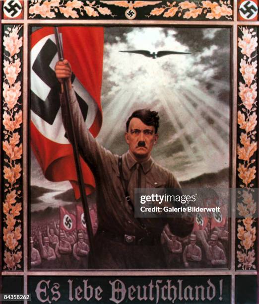 Nazi Party poster depicts Adolf Hitler bearing the German flag at the head of a vast army, with the caption 'Es Lebe Deutschland!' , circa 1935....