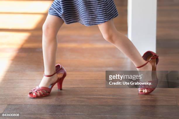 Bonn, Germany A girl dances in too big shoes on August 07, 2017 in Bonn, Germany.