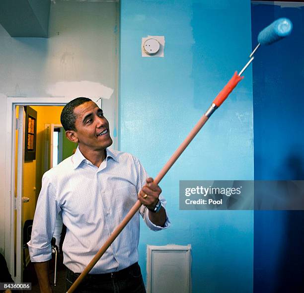 President-elect Barack Obama helps paint the walls at the Sasha Bruce House, a shelter for teens January 19, 2009 in Washington, DC., Obama stopped...