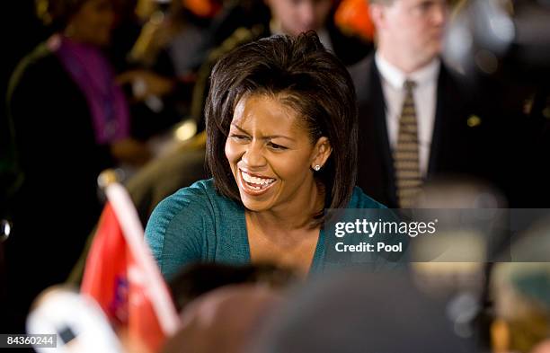 President-elect Barack Obama's wife Michelle Obama takes part in "Operation Gratitude" a public service event at RFK Stadium on January 19, 2009 in...