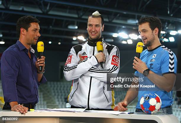 Presenter Marcus Schreyl, Pascal Hens of Germany and Markus Baur talk at RTL television channel programme after the Men's World Handball...