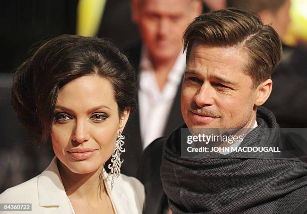 Actors Brad Pitt and Angelina Jolie pose on the red carpet for the German premiere of the film �The Curious Case of Benjamin Button� by US director...