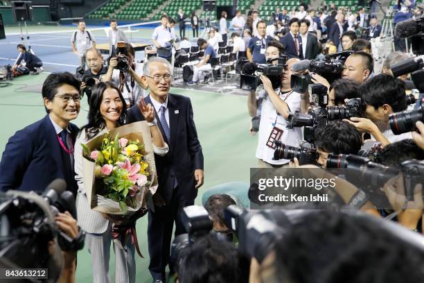 Tennis player Kimiko Date pose for photos with Nobuo Kuroyanagi and Tsuyoshi Fukui during a press conference on her second retirement at Ariake...