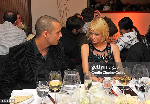 Photographer Nigel Barker and Paris Hilton attend the Bon Appetit Supper Club "A Sealed Fate?" dinner at Skylodge on January 18, 2009 in Park City,...