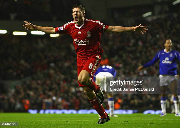 Steven Gerrard of Liverpool celebrates scoring the opening goal during the Barclays Premier League match between Liverpool and Everton at Anfield on...