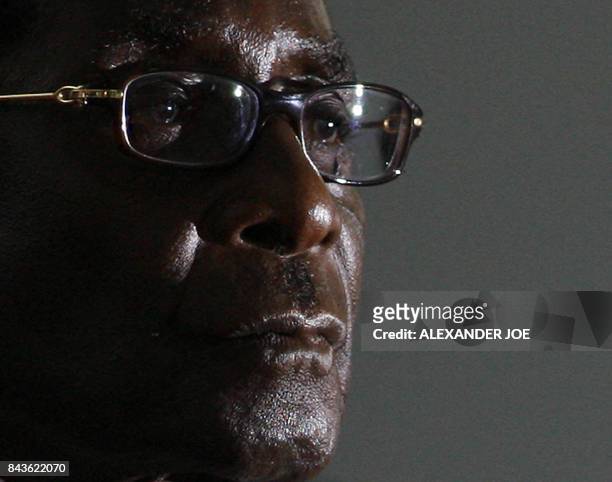 Zimbabwean President Robert Mugabe looks on as hi is sworn in for a sixth term in office in Harare, on June 29, 2008 after being declared the winner...