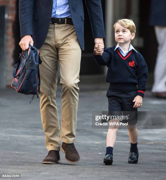 Prince George of Cambridge arrives for his first day of school with his father Prince William, Duke of Cambridge at Thomas's Battersea on September...