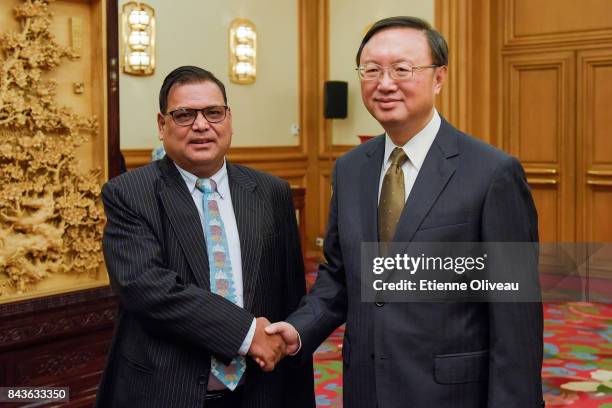 Deputy Prime Minister Of Nepal Krishna Bahadur Mahara shakes hands with Chinese State Councilor Yang Jiechi prior to meeting at Zhongnanhai...