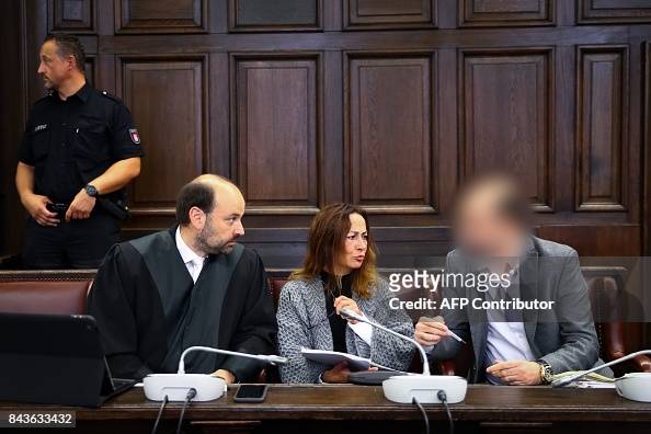 Defendant alleged Turkish spy Mehmet S sits in a court room next to ...
