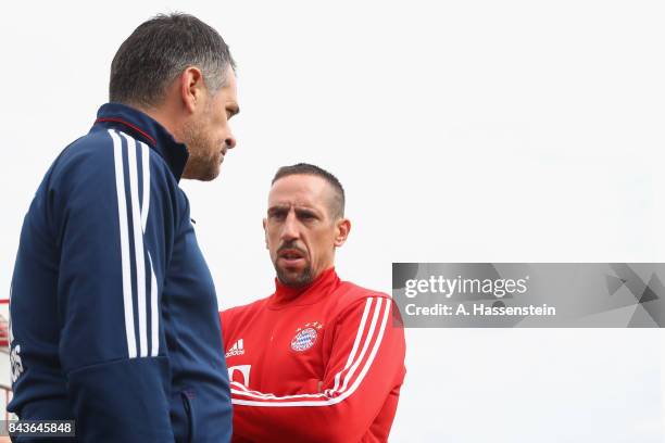 Willy Sagnol, assistent coach of FC Bayern Muenchen talks to his player Franck Ribery prior to a FC Bayern Muenchen training session at Saebener...