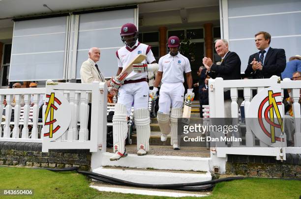 Kraigg Braithwaite and Rovman Powell of the West Indies makes their way out to open the batting during day one of the 3rd Investec Test Match between...