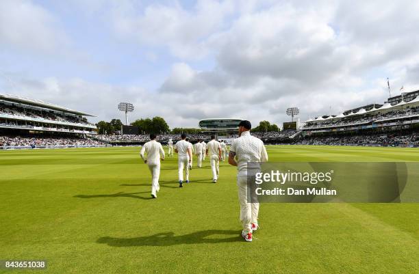 The England team make their way out to field during day one of the 3rd Investec Test Match between England and the West Indies at Lord's Cricket...