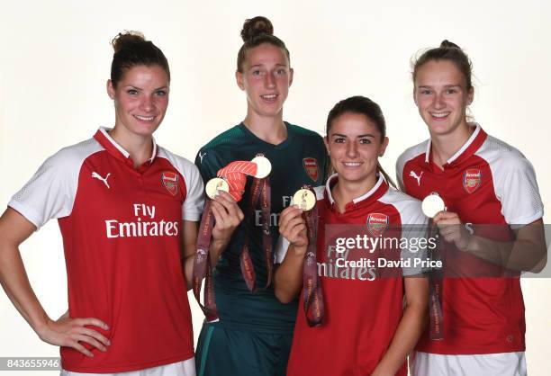 Dominique Janssen, Sari van Veenendaal, Danielle van de Donk and Vivianne Miedema of Arsenal Women with their European Championships Winners Medals...