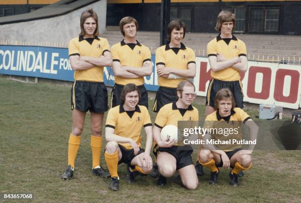 English singer-songwriter, and vice-president of Watford FC, Elton John at the Vicarage Road stadium in Watford with some of the players, April 1974.