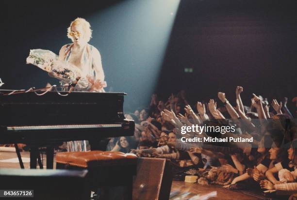 English singer-songwriter Elton John performs on stage, 1973.