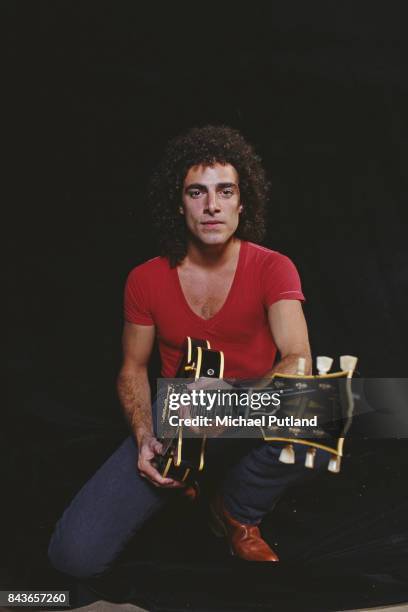 American guitarist Neal Schon of rock band Journey, poses for studio portrait holding a Gibson Les Paul guitar, New York, 1981.