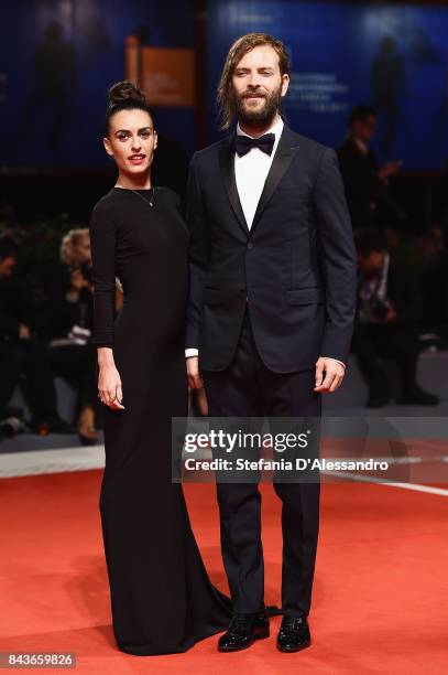 Roberta Pitrone and Alessandro Borghi walk the red carpet ahead of the 'Loving Pablo' screening during the 74th Venice Film Festival at Sala Grande...