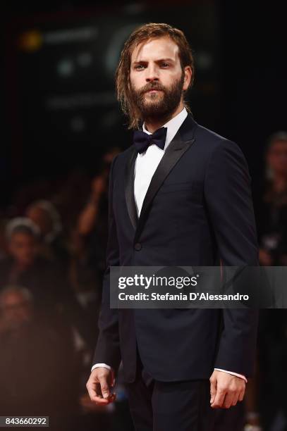 Alessandro Borghi walks the red carpet ahead of the 'Loving Pablo' screening during the 74th Venice Film Festival at Sala Grande on September 6, 2017...