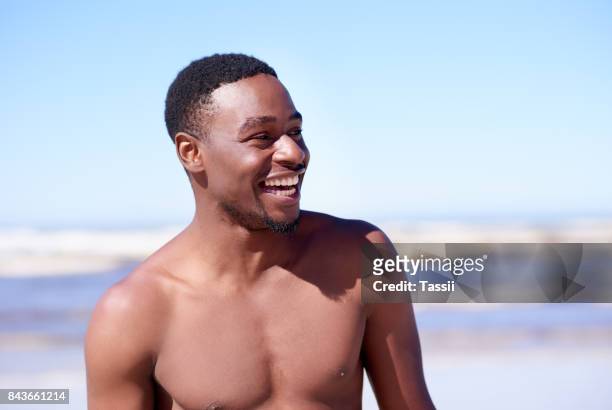 good vibes all summer long - hunky guy on beach stock pictures, royalty-free photos & images